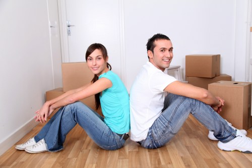 Professional movers loading furniture into a van in Westminster