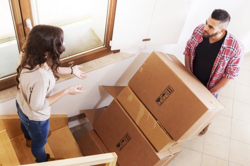 Packed office boxes and furniture ready for relocation in Westminster