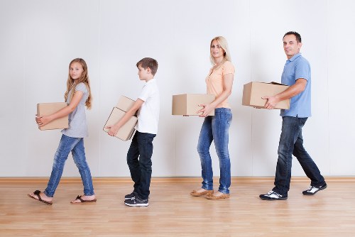 Organised unpacking of boxes into a Westminster apartment after delivery