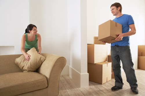 Professional movers handling packing and furniture protection for a Westminster home move